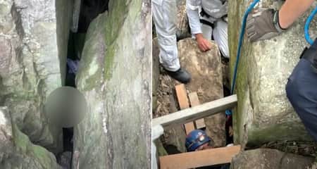 ফোন উদ্ধার করতে গিয়ে দুই পাথরের মাঝে উল্টো হয়ে আটকা পড়লেন নারী Woman