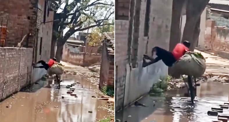 রাস্তায় কাদাপানি, স্প্যাইডারম্যানের মত সাইকেল নিয়ে পার হলেন যুবক কাদাপানি