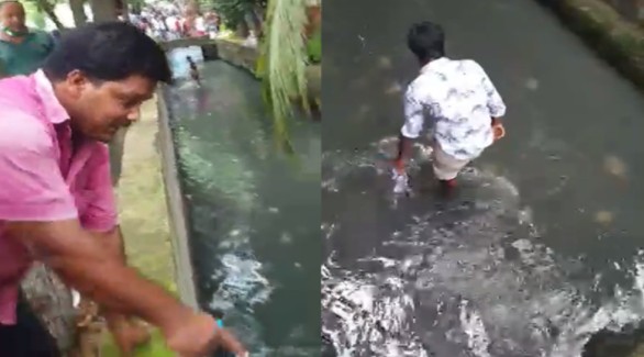 রাজশাহীতে ড্রেনে টাকা কুড়াচ্ছে মানুষ!