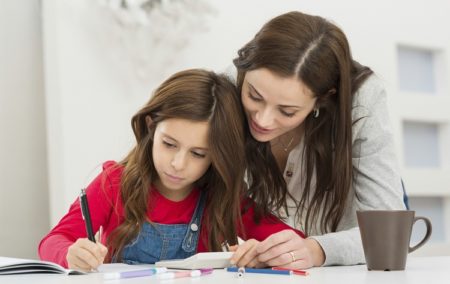 Mother Helping Her Daughter While Studying