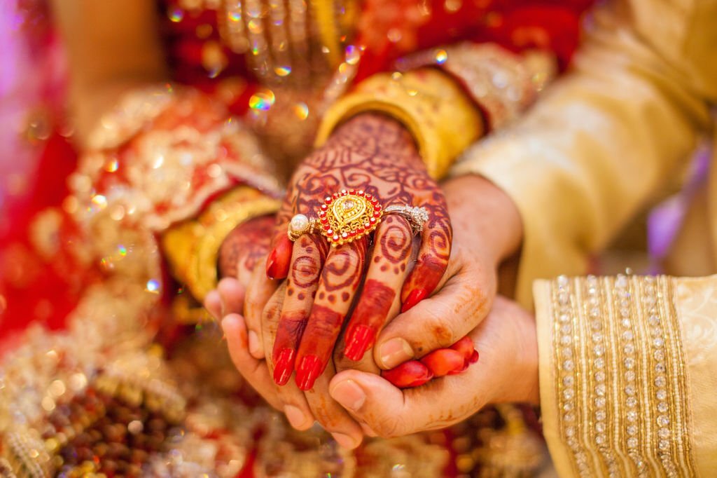 wedding hands with gold