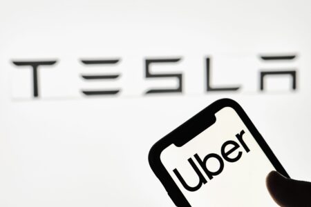 Uber CEO Sees Tesla as Partner or Rival in Trillion-Dollar AV Market robotaxi market