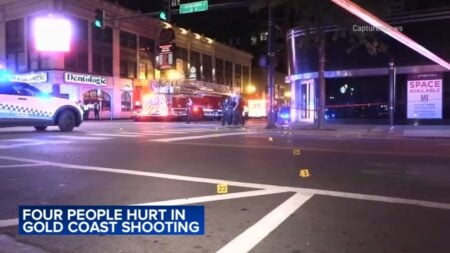 Chicago Gold Coast shooting: Four wounded in drive-by gunfire, suspect on run Chicago Gold Coast shooting Four wounded in drive-by gunfire, suspect on run