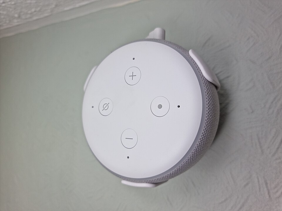 A smart speaker mounted on a wall